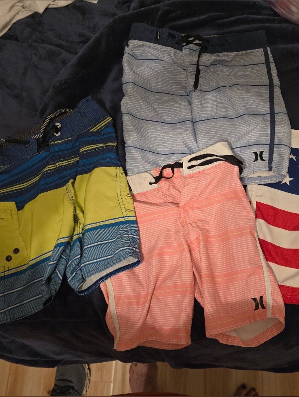 4 Board Shorts Size 6 (Blue Are Size 7)..3 Hurley And 1 Volcom